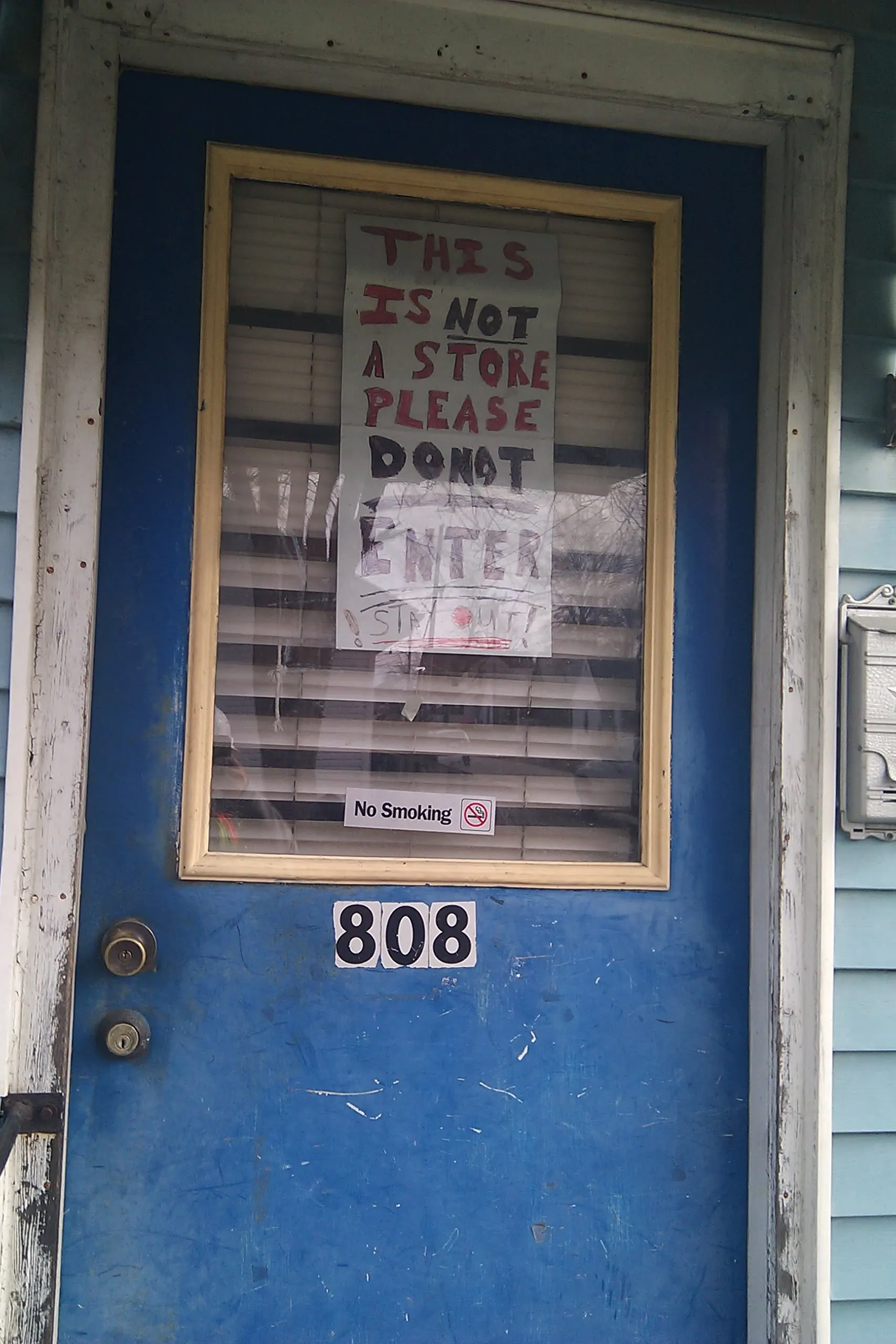 a door that has a sign that says 'this is not a store, keep out'