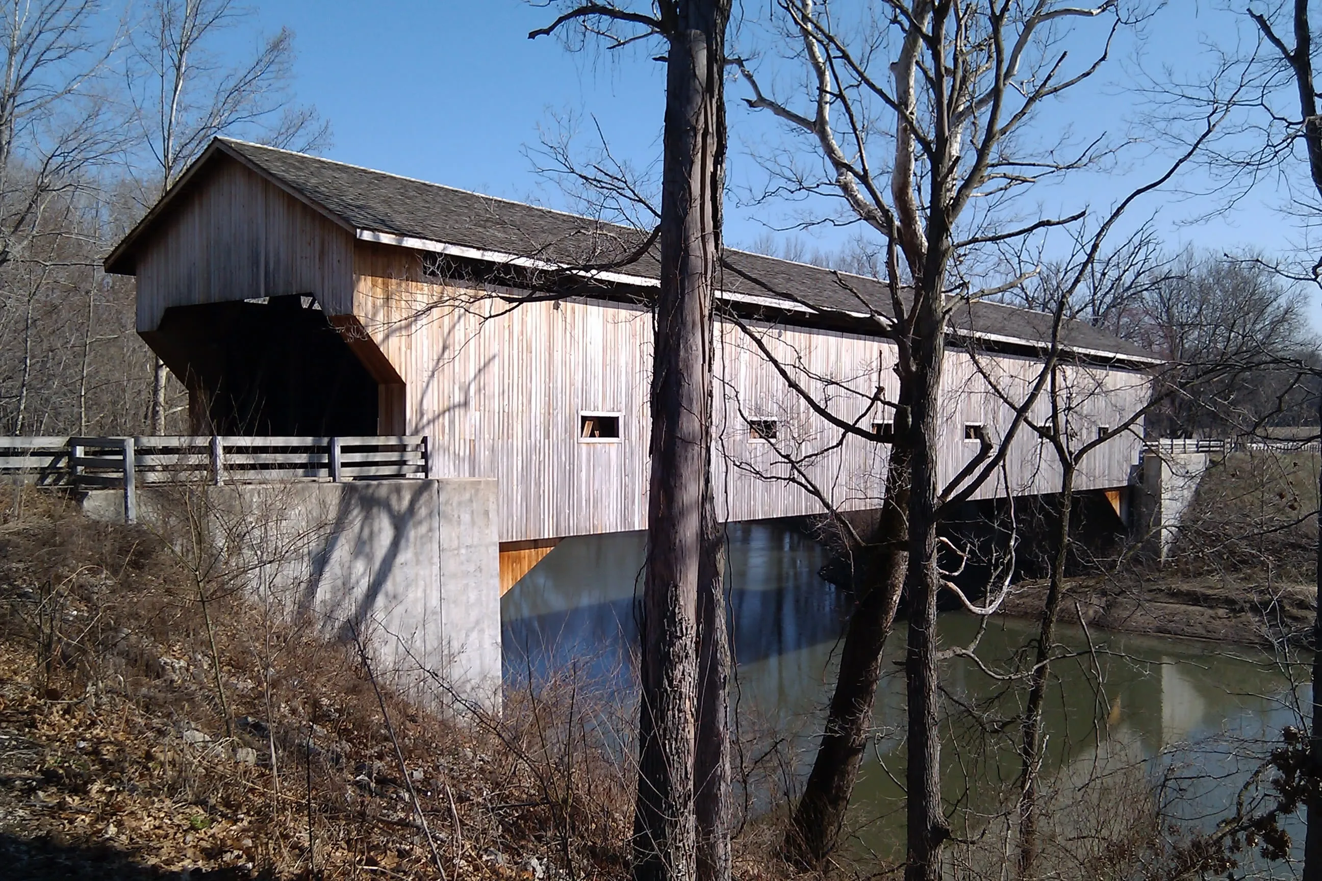 an intricate covered wooden bridge