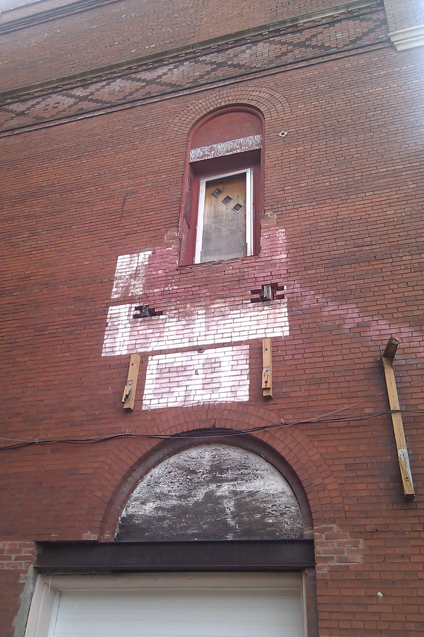 a 2nd floor door with a missing exterior stairway