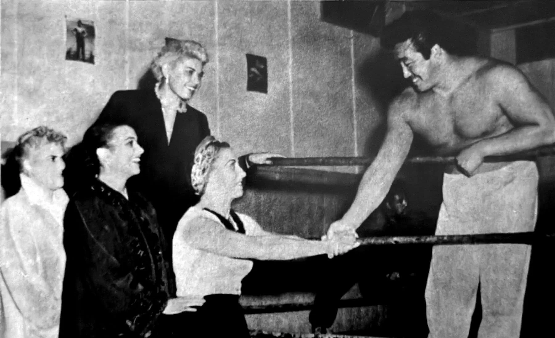 Rikidozan greeting a group of American women wrestlers in the ring