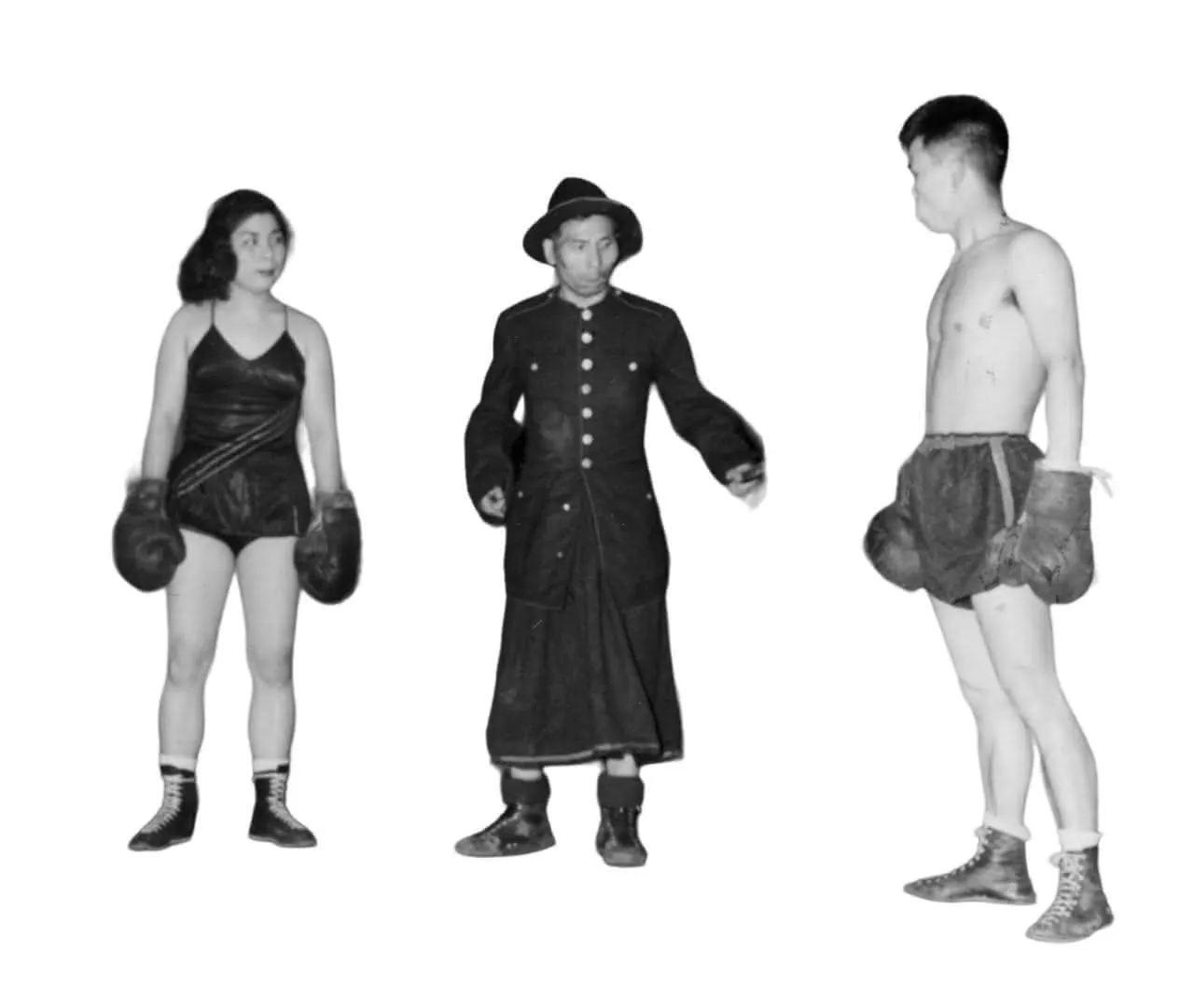 a man and a woman in oversized boxing gloves and in between them a man in more traditional Japanese clothing serving as referee